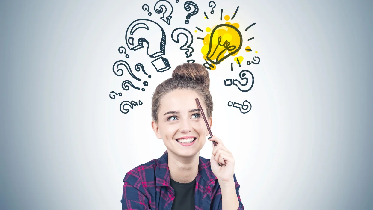 a boy holding a marker pen