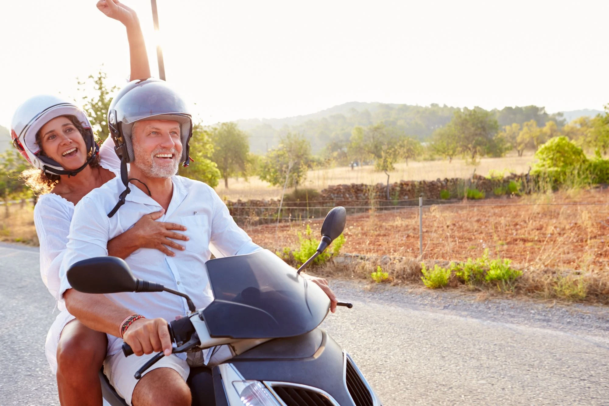 a man and a woman on a motorcycle